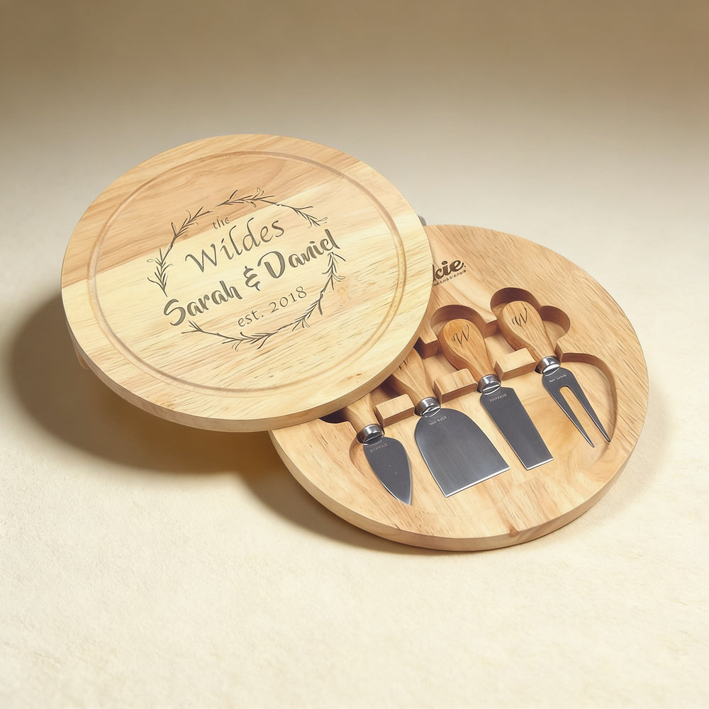 Custom engraved cheese board set with knife, fork, spreader, and slicer, laser engraving on natural wood grain