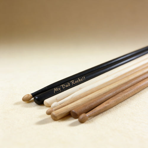 Black hickory drumsticks laser engraved with short phrase, midnight black finish