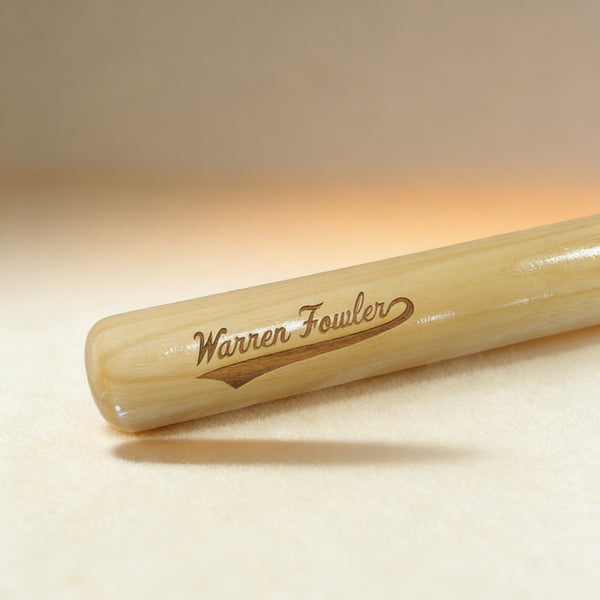 Custom engraved mini baseball bat with swoosh design and name, natural wood finish