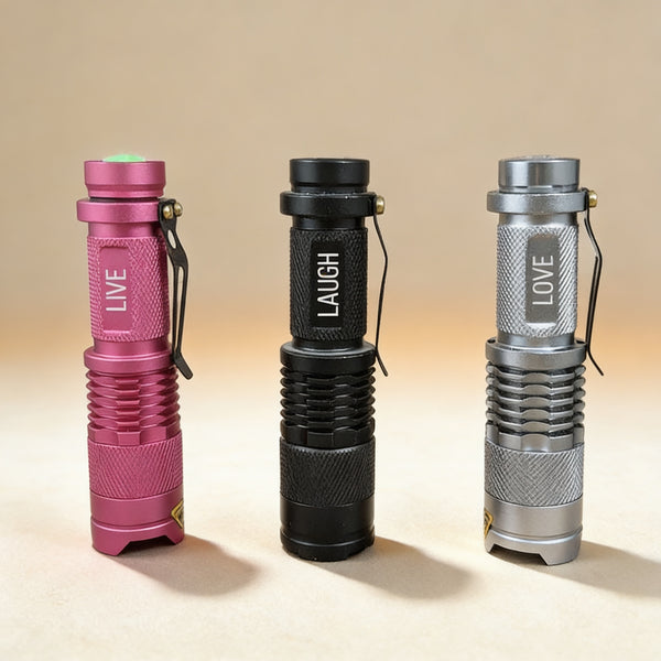 Personalized black aluminium flashlight engraved with a name on the barrel, 300-lumen LED focus beam