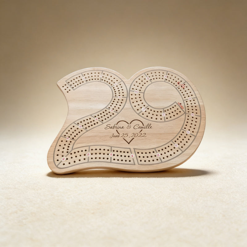 Custom engraved cribbage board with monogram, laser engraving on natural wood surface