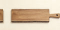 Top-down view of acacia natural edge serving board, blank surface ready for laser engraving