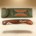 Personalized folding fillet knife engraved with a name on rosewood handle, stainless steel blade open