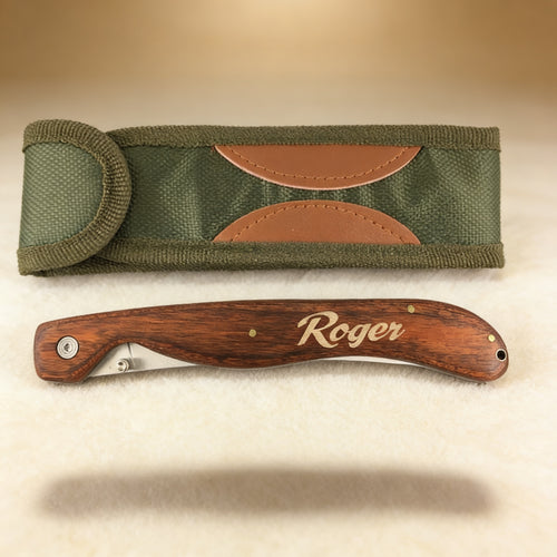 Personalized folding fillet knife engraved with a name on rosewood handle, stainless steel blade open
