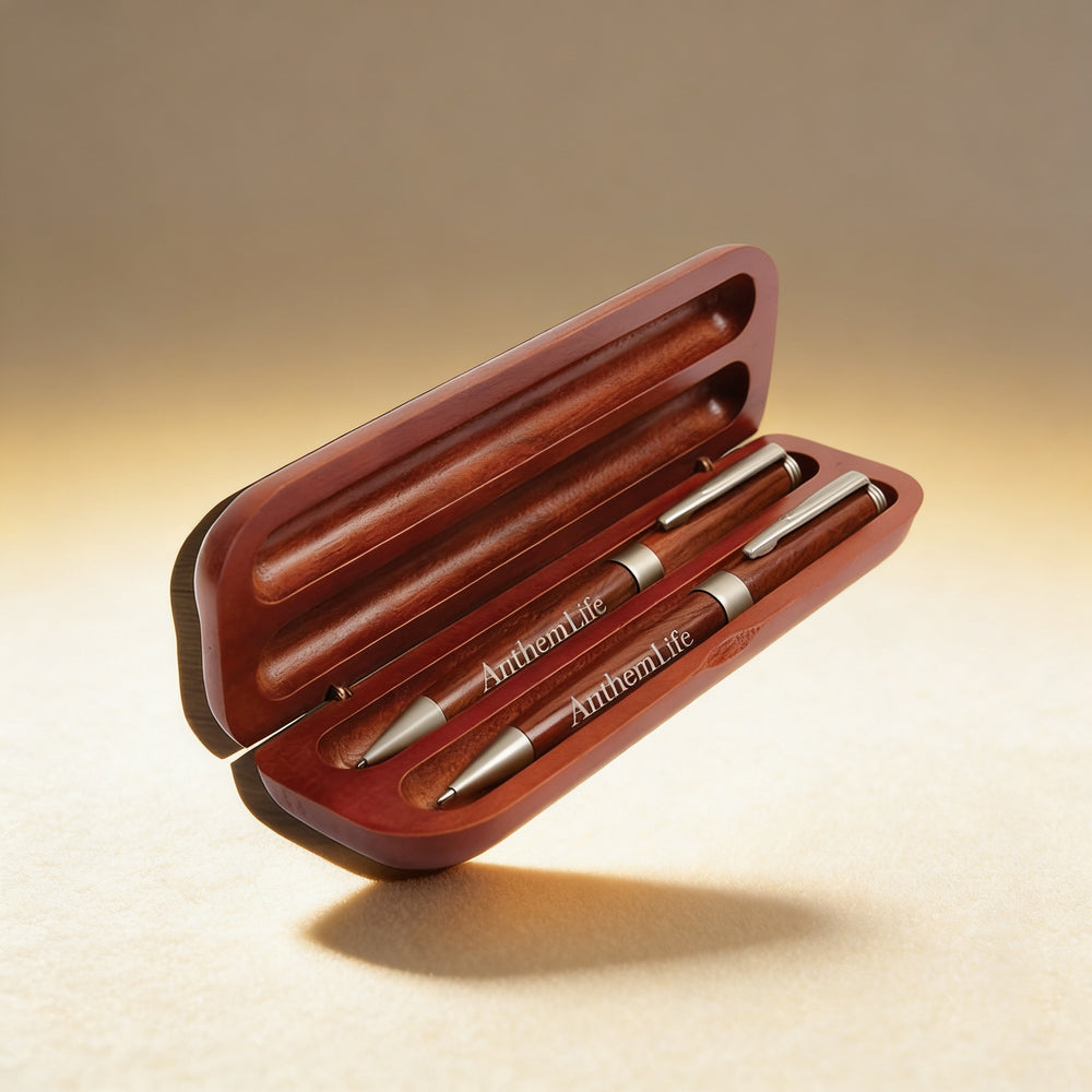 Personalized rosewood pen and pencil set engraved with a name, chrome trim detail on warm wood grain