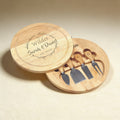 Custom engraved cheese board set with knife, fork, spreader, and slicer, laser engraving on natural wood grain