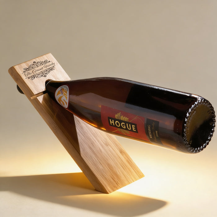 Personalized bamboo wine balancer engraved with a custom name, sustainably harvested bamboo