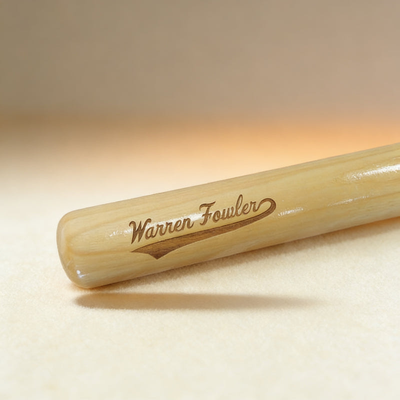 Custom engraved mini baseball bat with swoosh design and name, natural wood finish