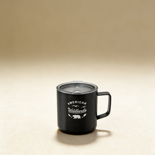 Custom engraved coffee mug with monogram, double-wall stainless steel in navy, shown on a wooden surface