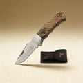 Personalized gentlemen's pocket knife engraved with a name on the handle, stainless steel blade