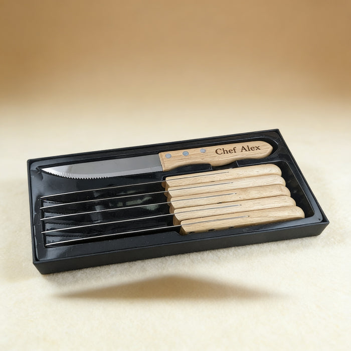 Personalized steak knife set of 6 engraved with a family name, serrated steel blades and maple handles
