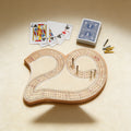 Personalized solid wood cribbage board engraved with a family name, 29-shape, 10.25 x 7.75 inches