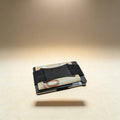 Gunmetal aluminum minimalist wallet with custom laser-engraved name, front view