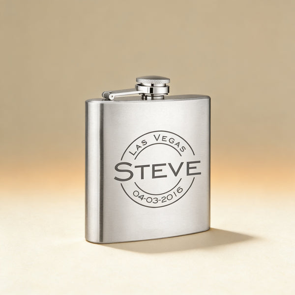 Matte black hip flask engraved with initials, shown with rosewood gift box and shot glass set